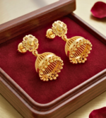 gold jhumka earrings featuring a floral stud top and a bell- shaped hanging dome with delicate bead detailing. - Image 2