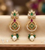 Gold-plated traditional drop earring adorned with green and ruby-colored stones, sparkling zircons, and a dangling pearl drop.