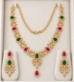 Gold Plated necklace set with alternating green and ruby-pink teardrop stones, white crystal accents, and matching drop earrings - Image 8