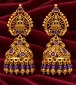 Jhumka earrings featuring intricate traditional motifs, purple-blue accent stones. - Image 2